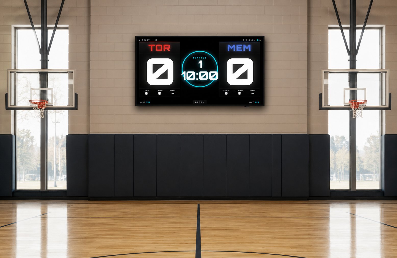 BALL OS scoreboard mounted on a gym wall above the padded base, showing TOR vs MEM, Quarter 1, 10:00
