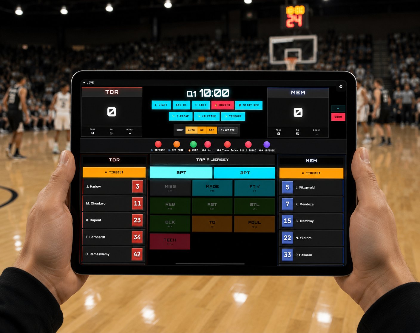 A scorer holding an iPad showing the BALL OS scoring tablet UI with TOR and MEM rosters, score buttons, and play controls.